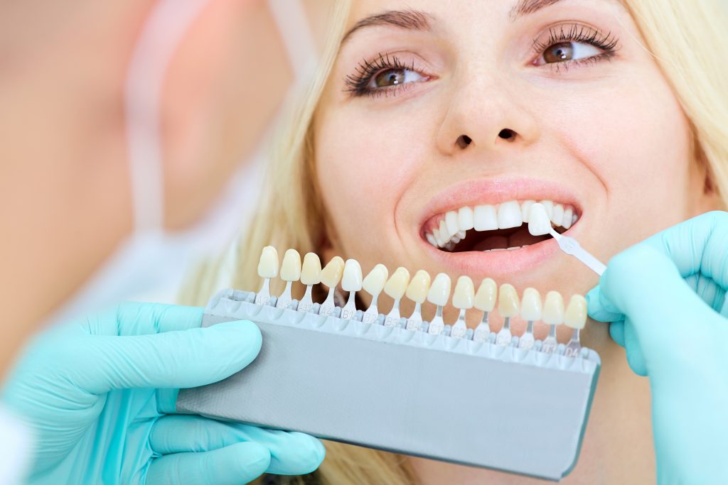 Closeup of a girl with beautiful smile at the dentist